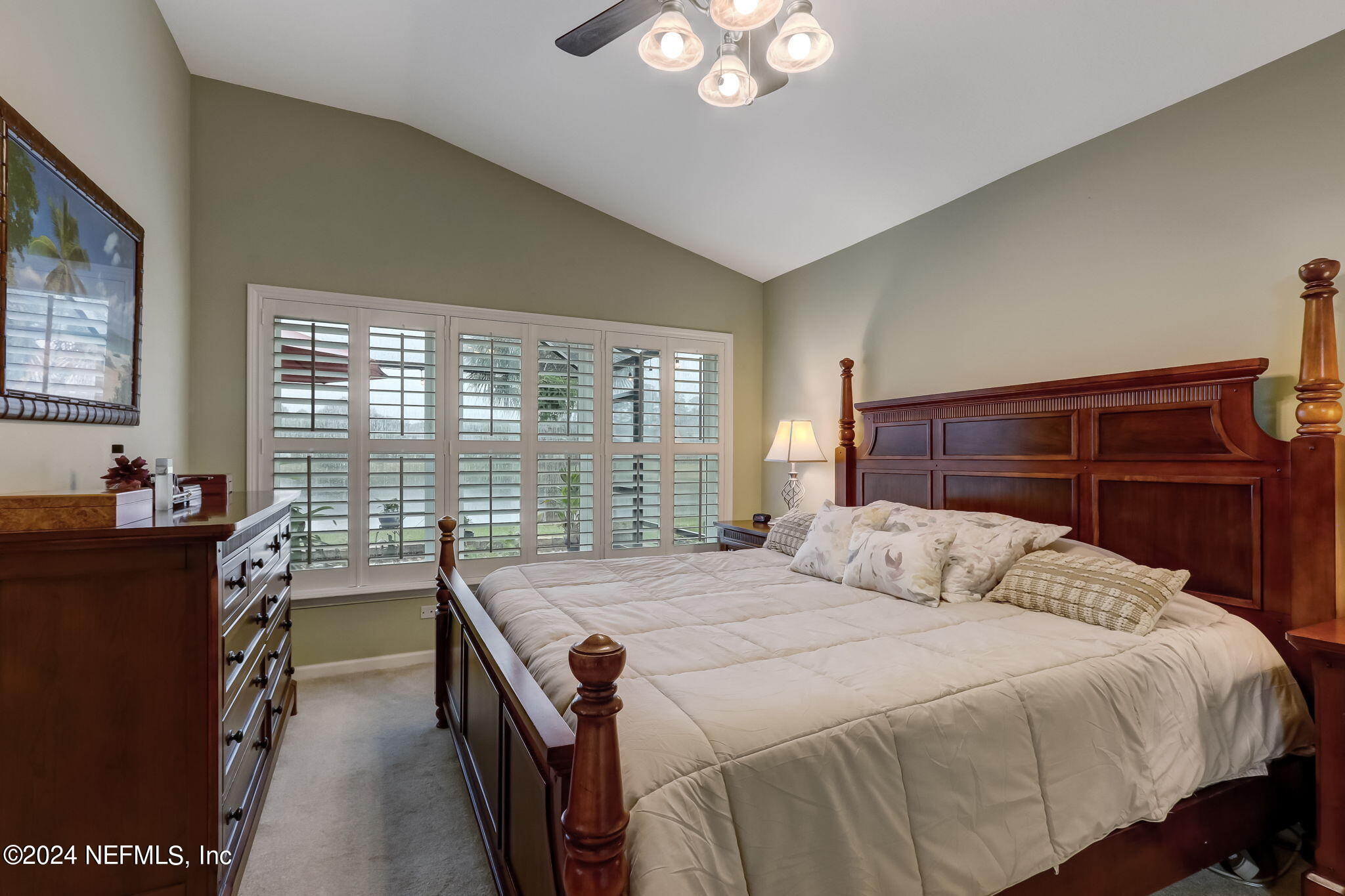 11230 Water Spring Circle Jacksonville, FL 32256 - Photo 24 of 91 a bedroom with a bed and a large window