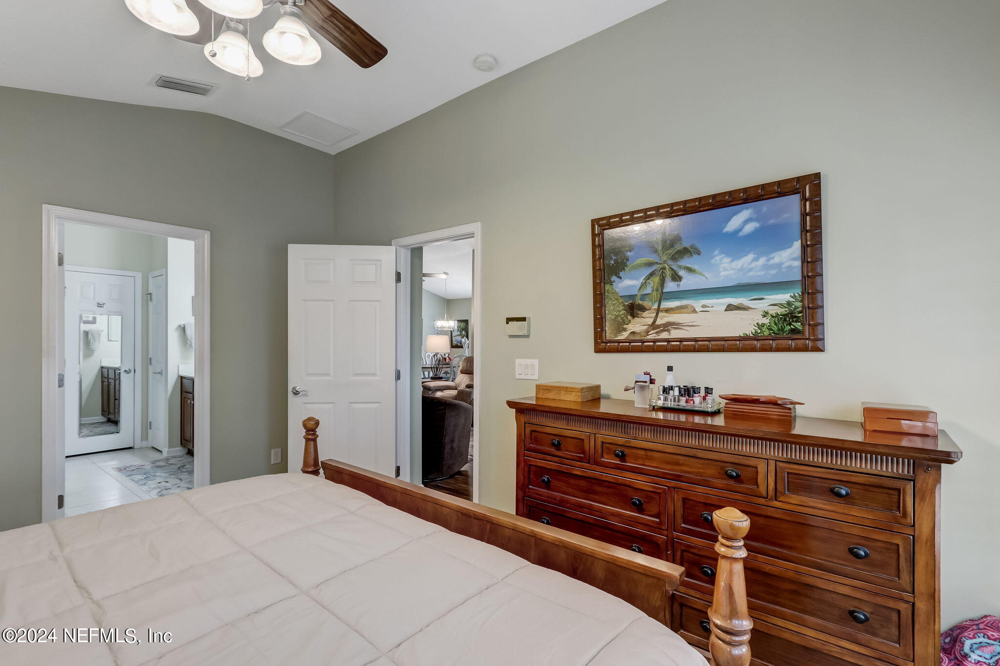 11230 Water Spring Circle Jacksonville, FL 32256 - Photo 26 of 91 a bedroom with a bed and a dresser
