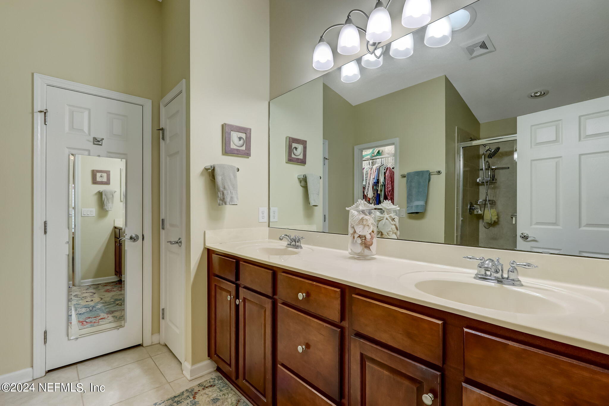 11230 Water Spring Circle Jacksonville, FL 32256 - Photo 27 of 91 a bathroom with a double vanity sink and a mirror