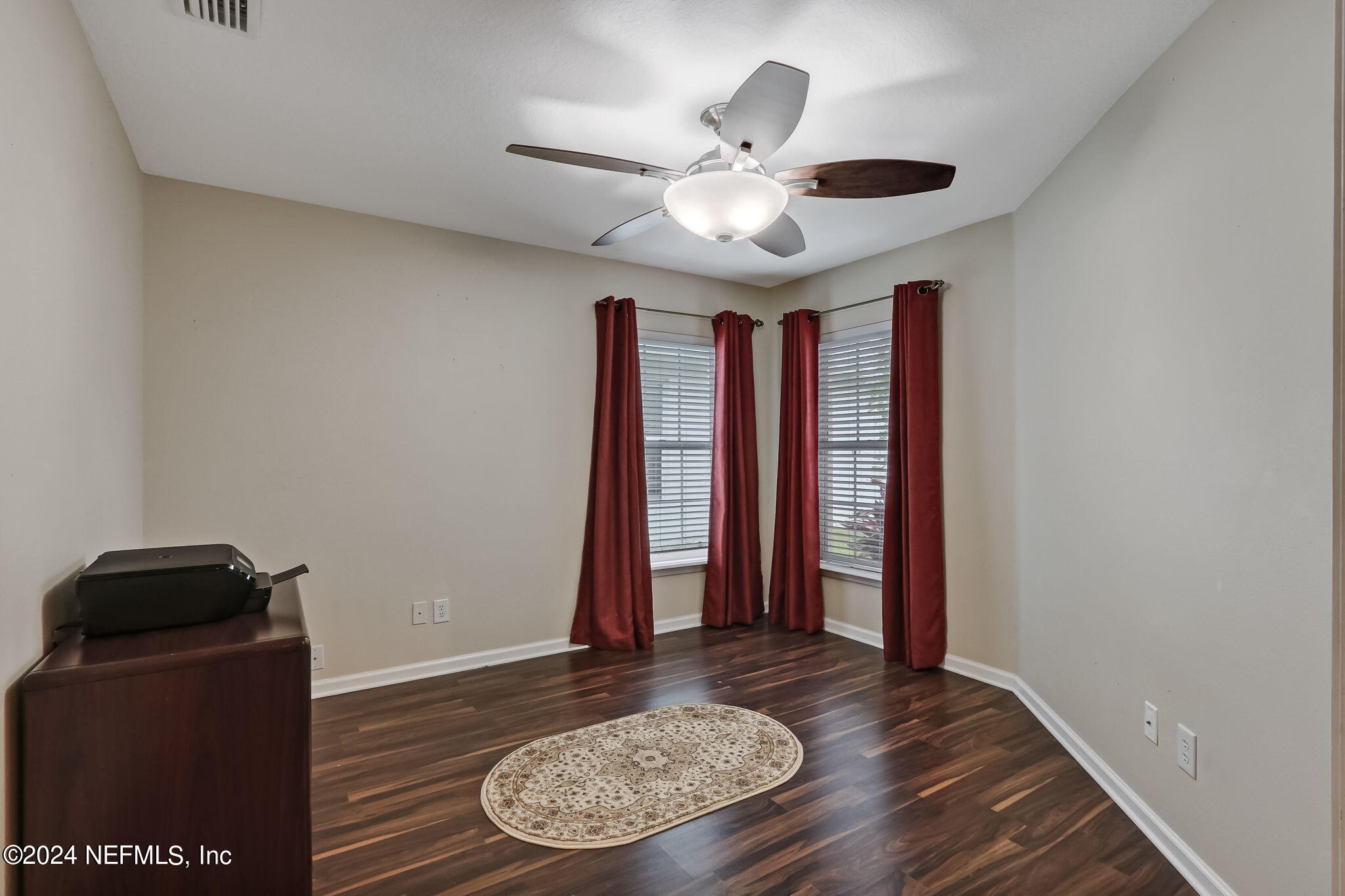 11230 Water Spring Circle Jacksonville, FL 32256 - Photo 30 of 91 a view of an empty room with window and wooden floor