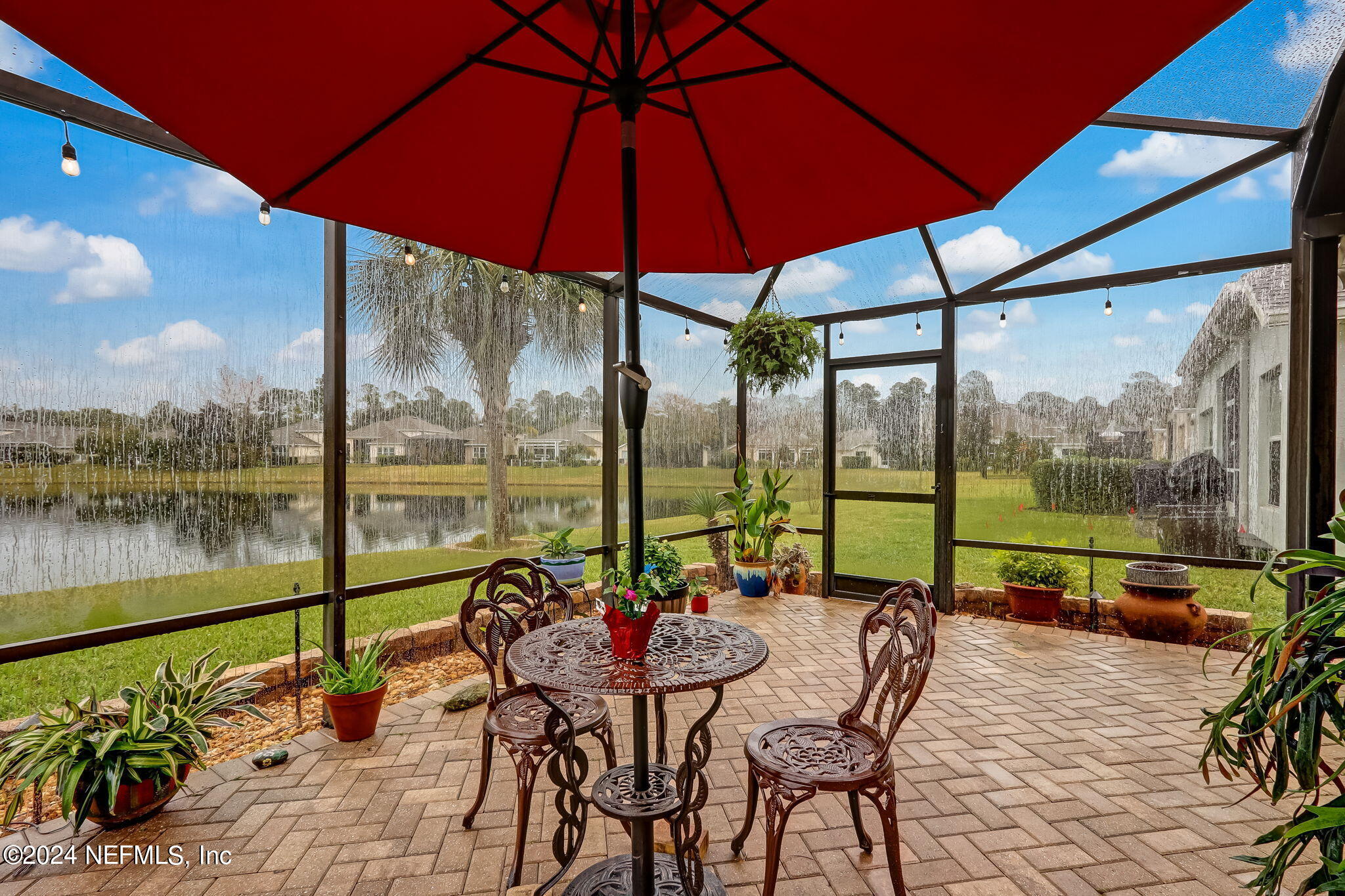 11230 Water Spring Circle Jacksonville, FL 32256 - Photo 38 of 91 a view of swimming pool with a table and chairs under an umbrella