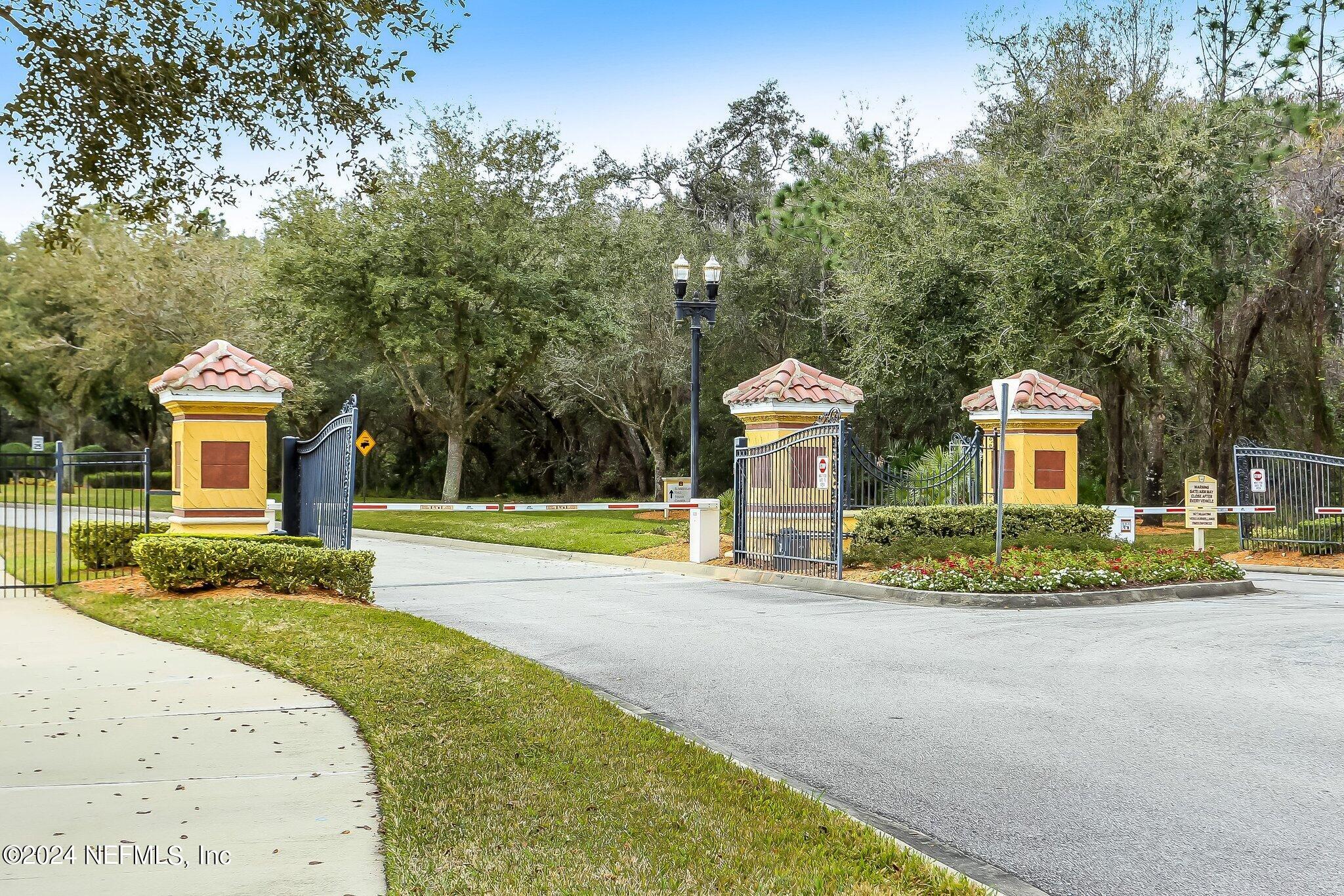 11230 Water Spring Circle Jacksonville, FL 32256 - Photo 69 of 91 a view of a house with a swimming pool and a large tree
