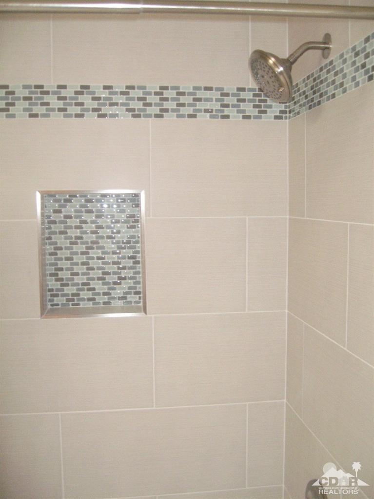 200 East Racquet Club Road, Unit 52 Palm Springs, CA 92262 - Photo 12 of 28 a bathroom with a shower