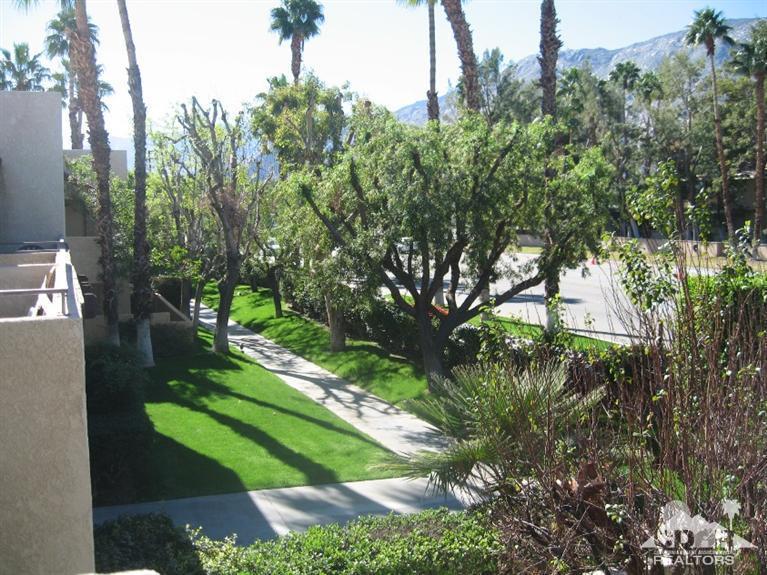 200 East Racquet Club Road, Unit 52 Palm Springs, CA 92262 - Photo 20 of 28 a green field with lots of trees in it