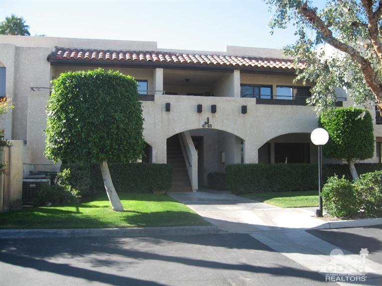 200 East Racquet Club Road, Unit 52 Palm Springs, CA 92262 - Photo 21 of 28 a front view of a house with garden