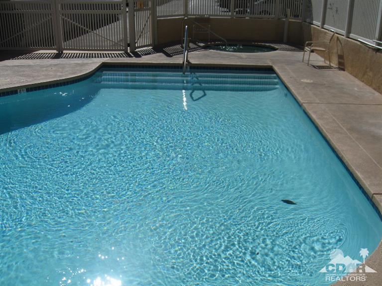 200 East Racquet Club Road, Unit 52 Palm Springs, CA 92262 - Photo 22 of 28 a bathroom with a sink and mirror
