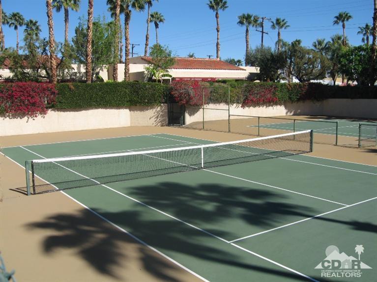 200 East Racquet Club Road, Unit 52 Palm Springs, CA 92262 - Photo 23 of 28 a view of a tennis court