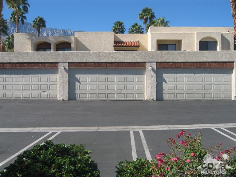 200 East Racquet Club Road, Unit 52 Palm Springs, CA 92262 - Photo 24 of 28 a view of white house with a potted plant