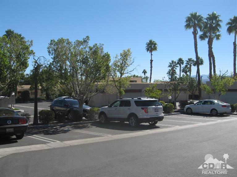 200 East Racquet Club Road, Unit 52 Palm Springs, CA 92262 - Photo 25 of 28 a car parked on the side of the road
