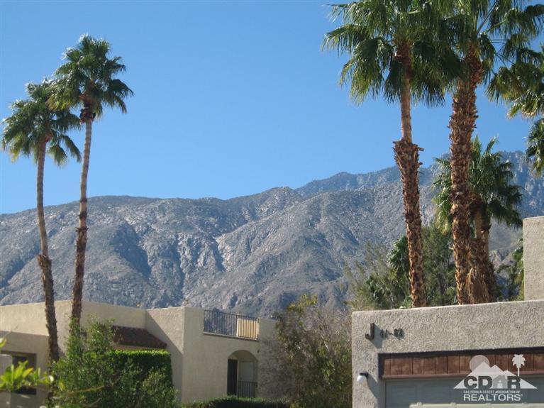 200 East Racquet Club Road, Unit 52 Palm Springs, CA 92262 - Photo 26 of 28 an aerial view of a house with a palm tree