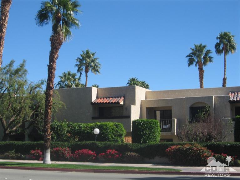 200 East Racquet Club Road, Unit 52 Palm Springs, CA 92262 - Photo 27 of 28 a sign that is sitting on the side of a road