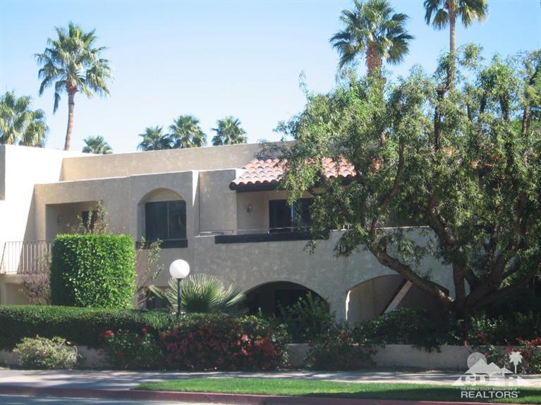200 East Racquet Club Road, Unit 52 Palm Springs, CA 92262 - Photo 28 of 28 a house with a tree in front of it