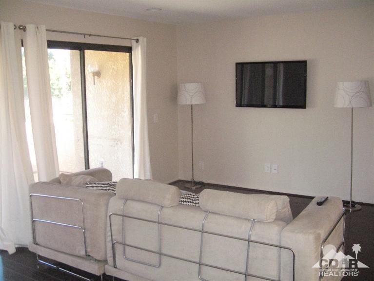 200 East Racquet Club Road, Unit 52 Palm Springs, CA 92262 - Photo 9 of 28 a room with a bed and a window