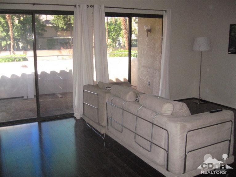 200 East Racquet Club Road, Unit 52 Palm Springs, CA 92262 - Photo 10 of 28 a bathroom with a double vanity sink and a window