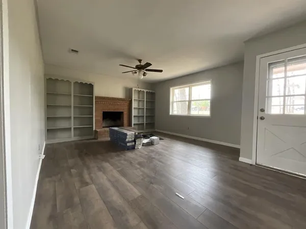 a view of a livingroom with furniture and a fireplace