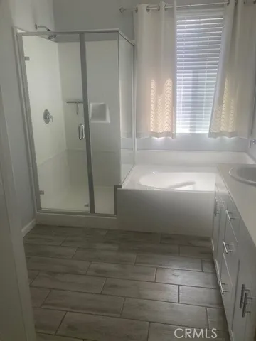 a living room with furniture a rug and a window