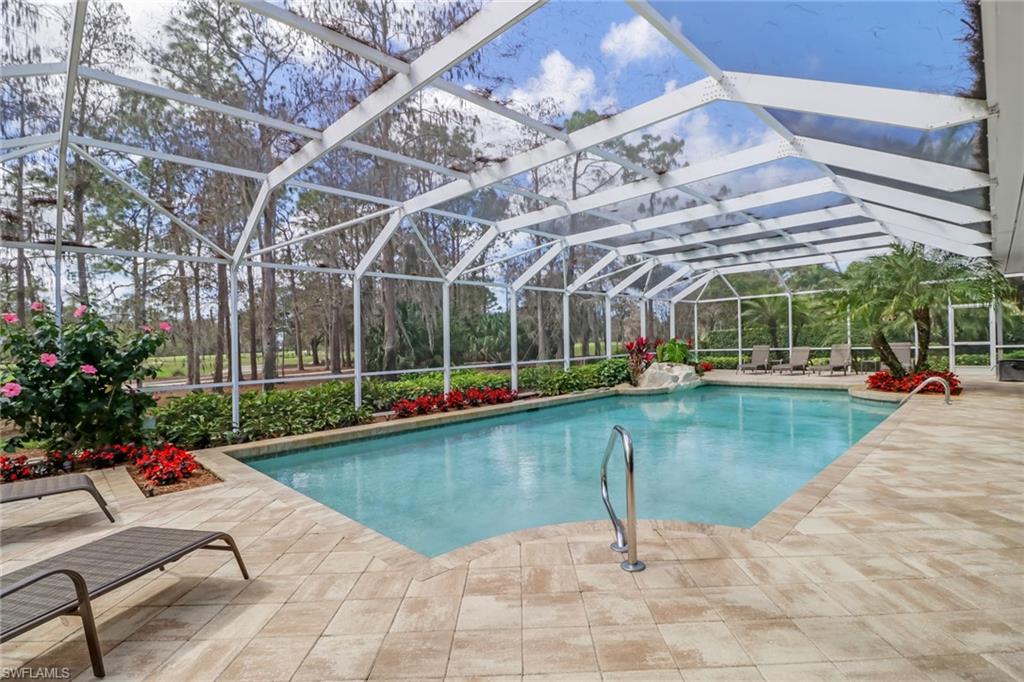 4556 Silver Fox Drive Naples, FL 34119 - Photo 11 of 22 a view of a swimming pool with a patio