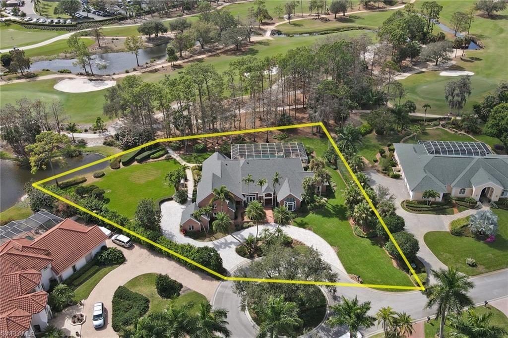 4556 Silver Fox Drive Naples, FL 34119 - Photo 20 of 22 an aerial view of a house
