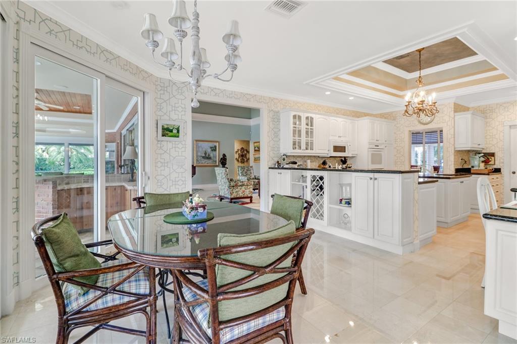 4556 Silver Fox Drive Naples, FL 34119 - Photo 5 of 22 a dining room with furniture and window