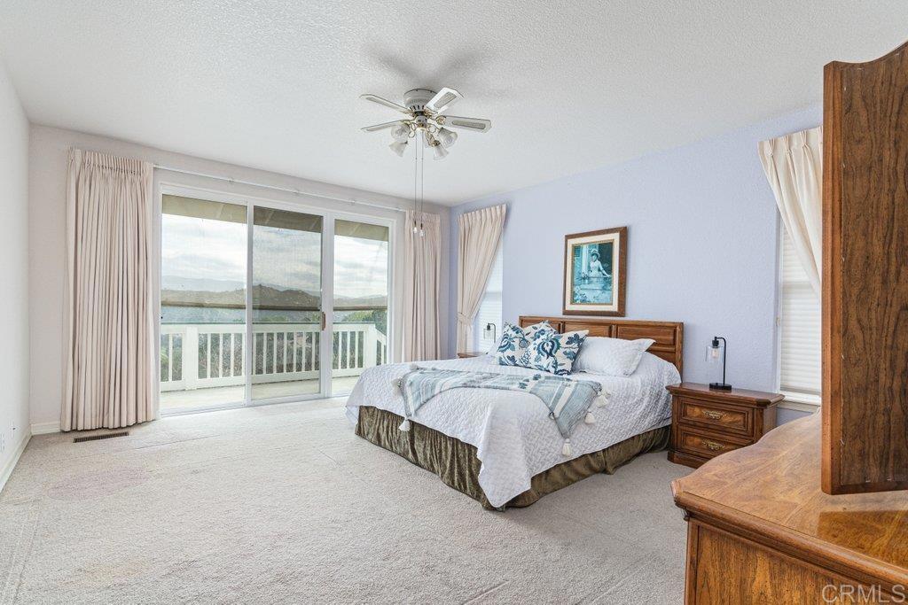 4327 Hollyhill Road Vista, CA 92084 - Photo 20 of 40 Guest Bedroom with Deck Access/Ensuite