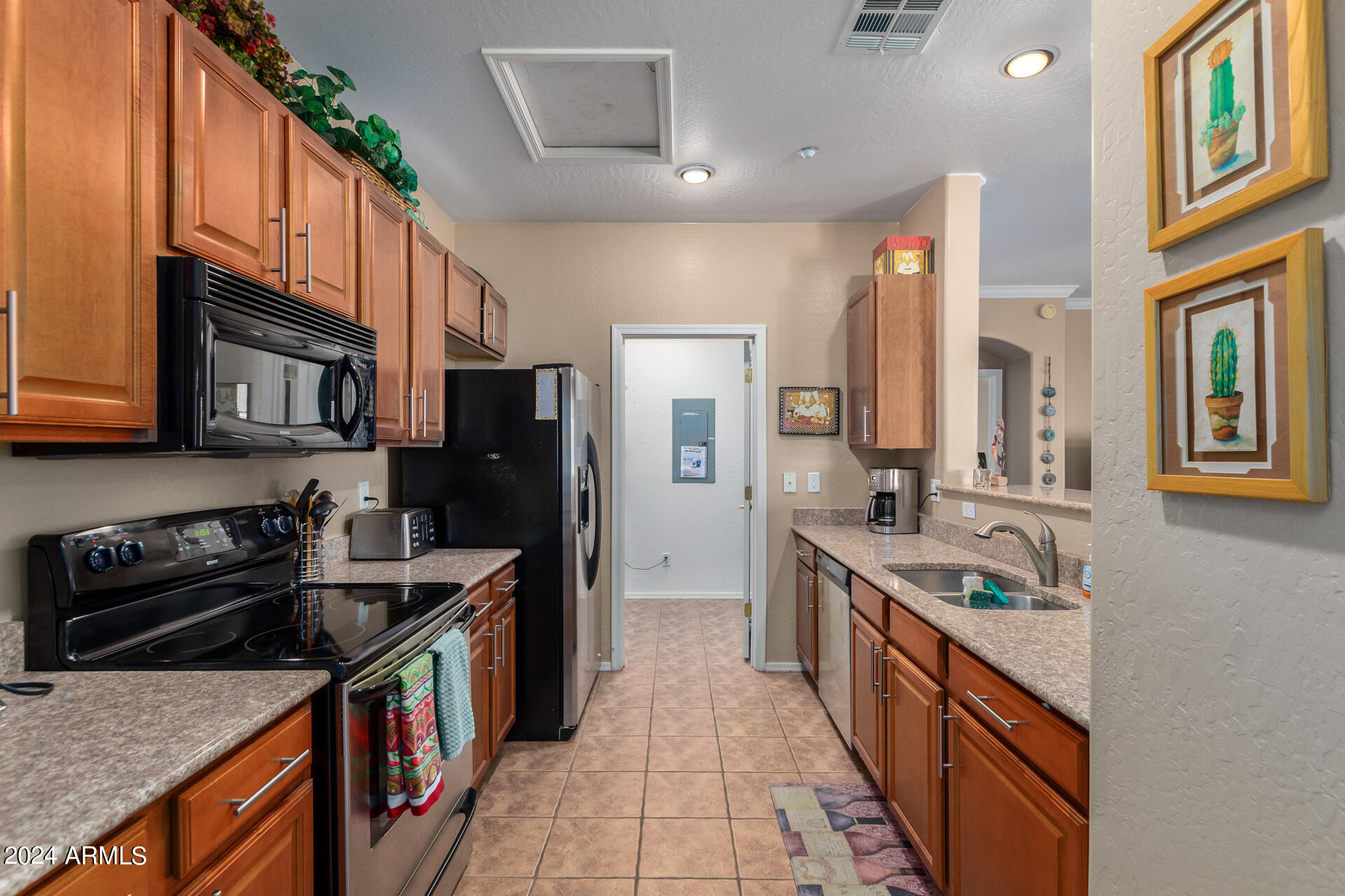 955 East Knox Road, Unit 244 Chandler, AZ 85225 - Photo 11 of 47 a kitchen with stainless steel appliances granite countertop a stove and a sink