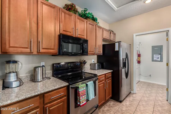 a bathroom with double vanity and a mirror
