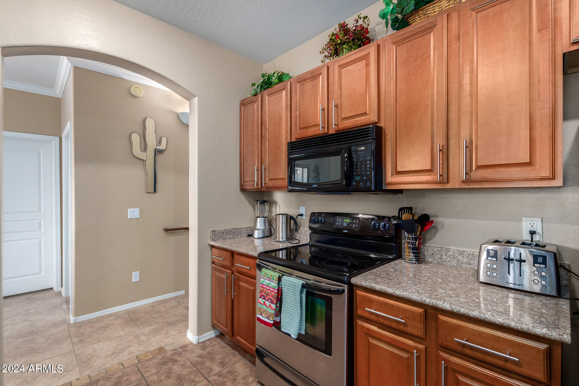 955 East Knox Road, Unit 244 Chandler, AZ 85225 - Photo 15 of 47 a kitchen with stainless steel appliances granite countertop a stove a sink and a microwave