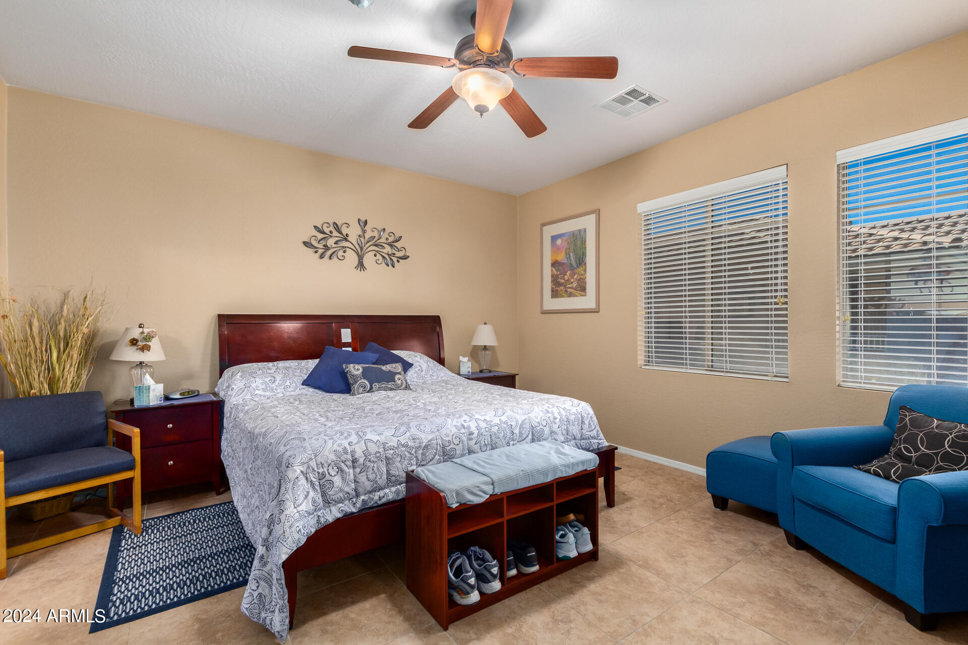 955 East Knox Road, Unit 244 Chandler, AZ 85225 - Photo 16 of 47 a bedroom with a bed a couch and a chandelier