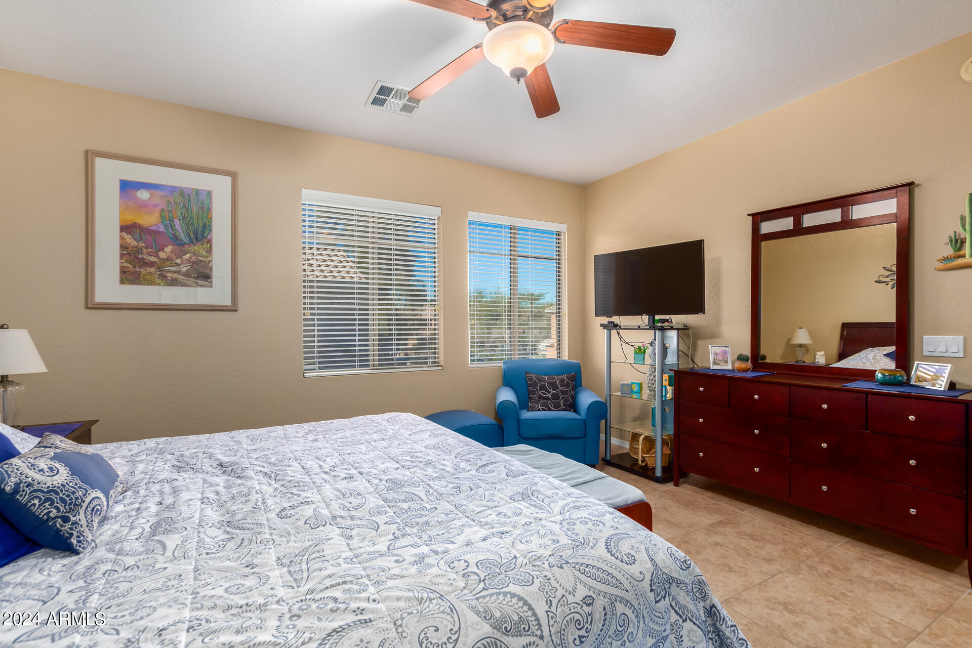 955 East Knox Road, Unit 244 Chandler, AZ 85225 - Photo 17 of 47 a bedroom with a bed and a flat screen tv