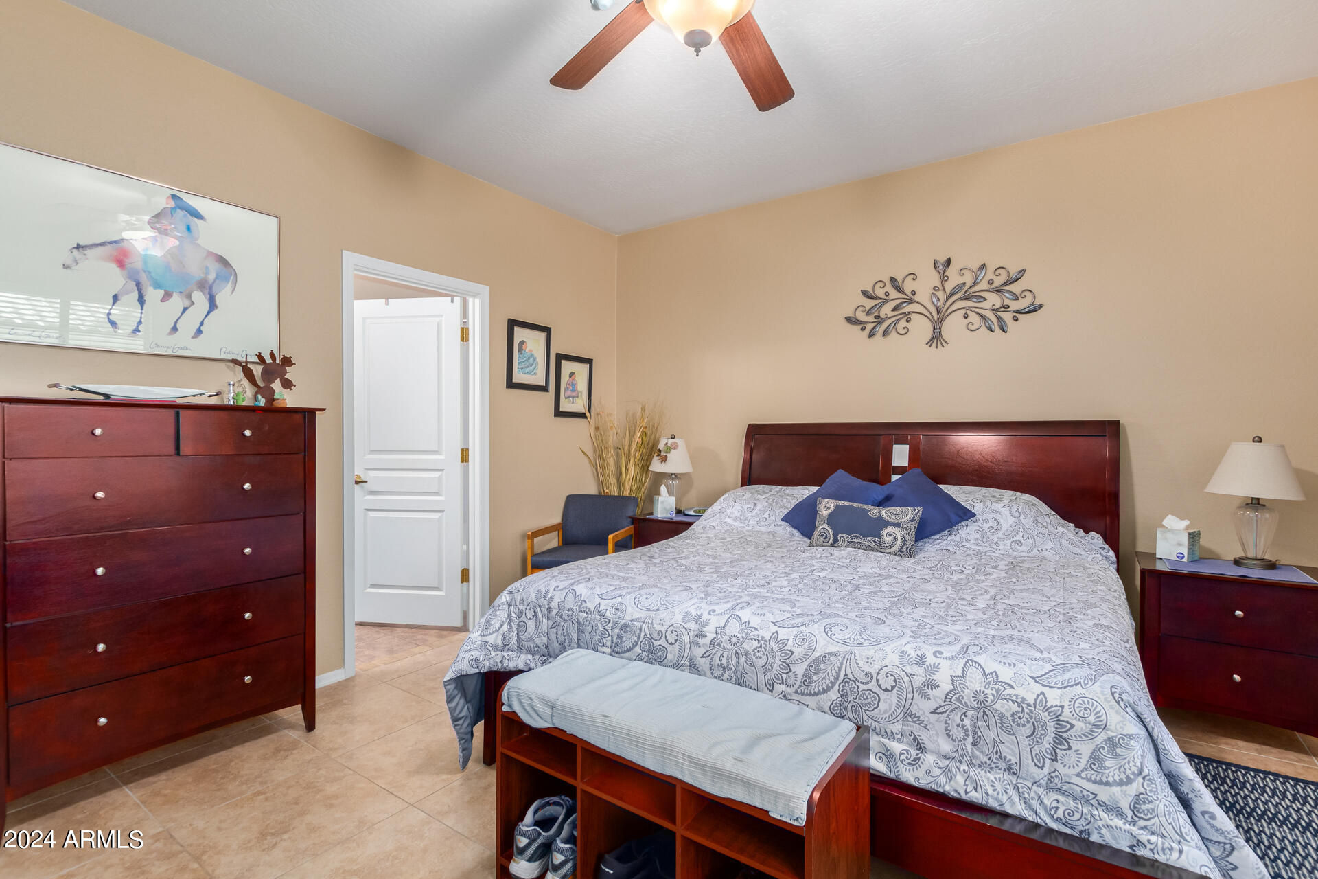 955 East Knox Road, Unit 244 Chandler, AZ 85225 - Photo 18 of 47 a bedroom with a bed and painting on the wall