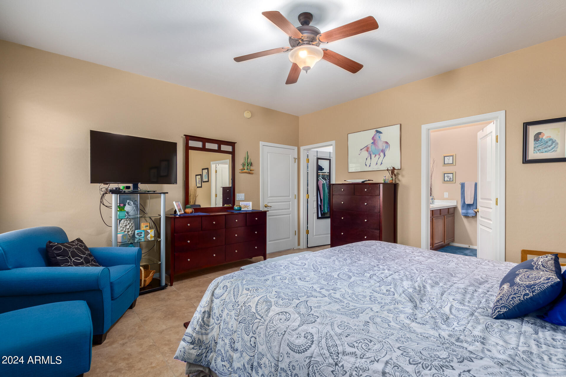 955 East Knox Road, Unit 244 Chandler, AZ 85225 - Photo 19 of 47 a bedroom with a bed and a dresser with wooden floor