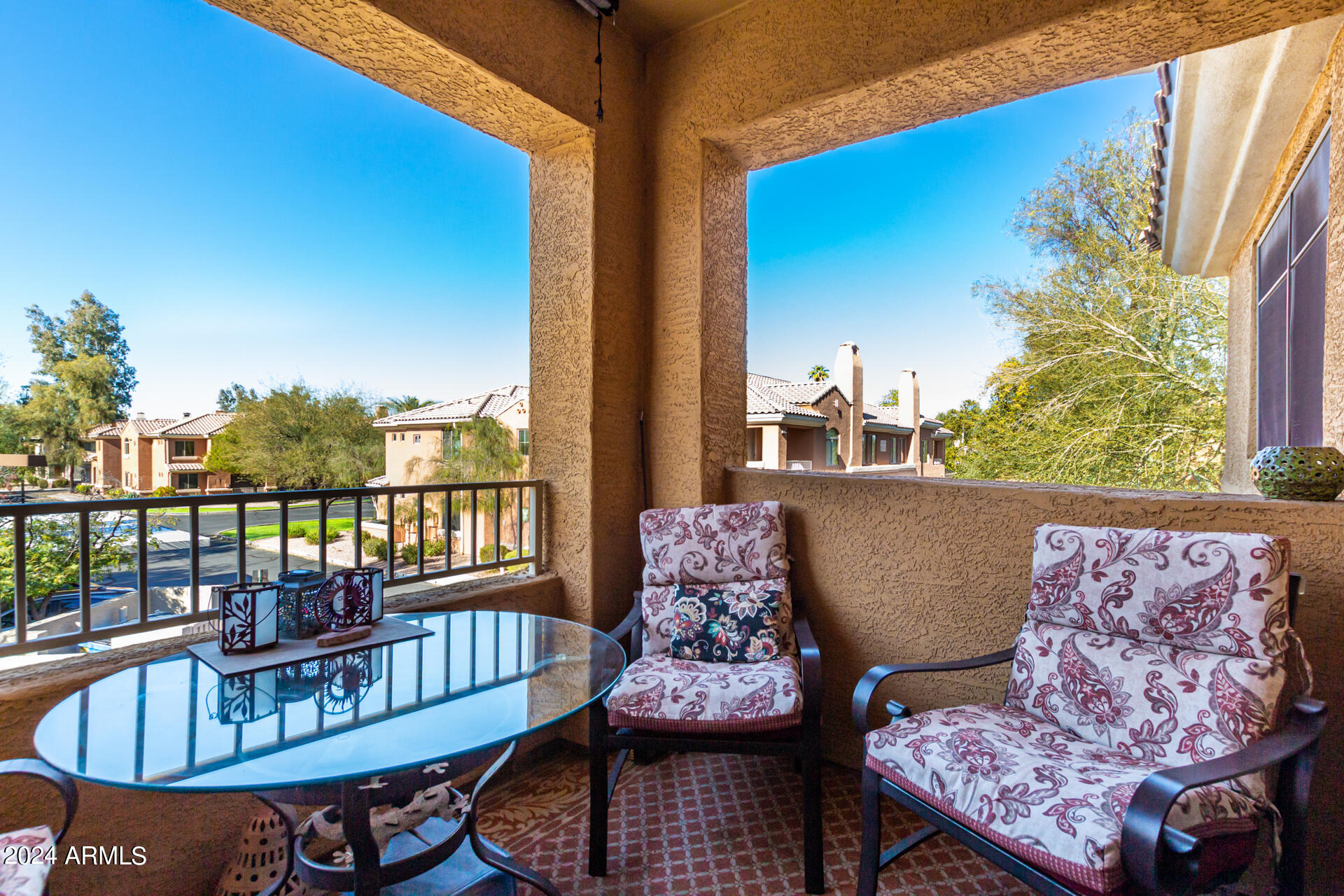 955 East Knox Road, Unit 244 Chandler, AZ 85225 - Photo 30 of 47 a view of a balcony with furniture and a potted plant