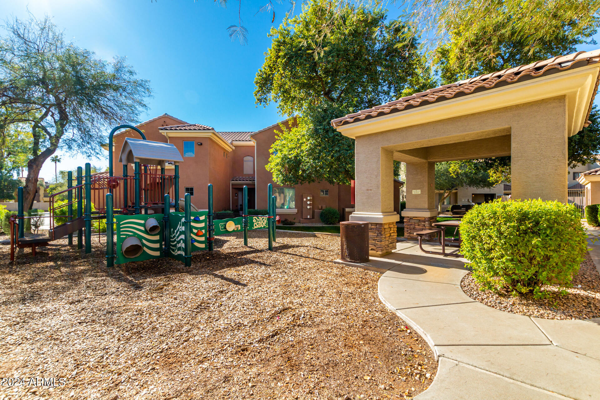 955 East Knox Road, Unit 244 Chandler, AZ 85225 - Photo 35 of 47 a view of a house with backyard sitting area and garden