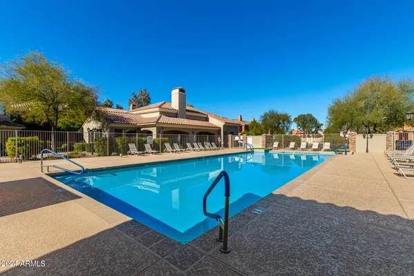 a view of a house with swimming pool