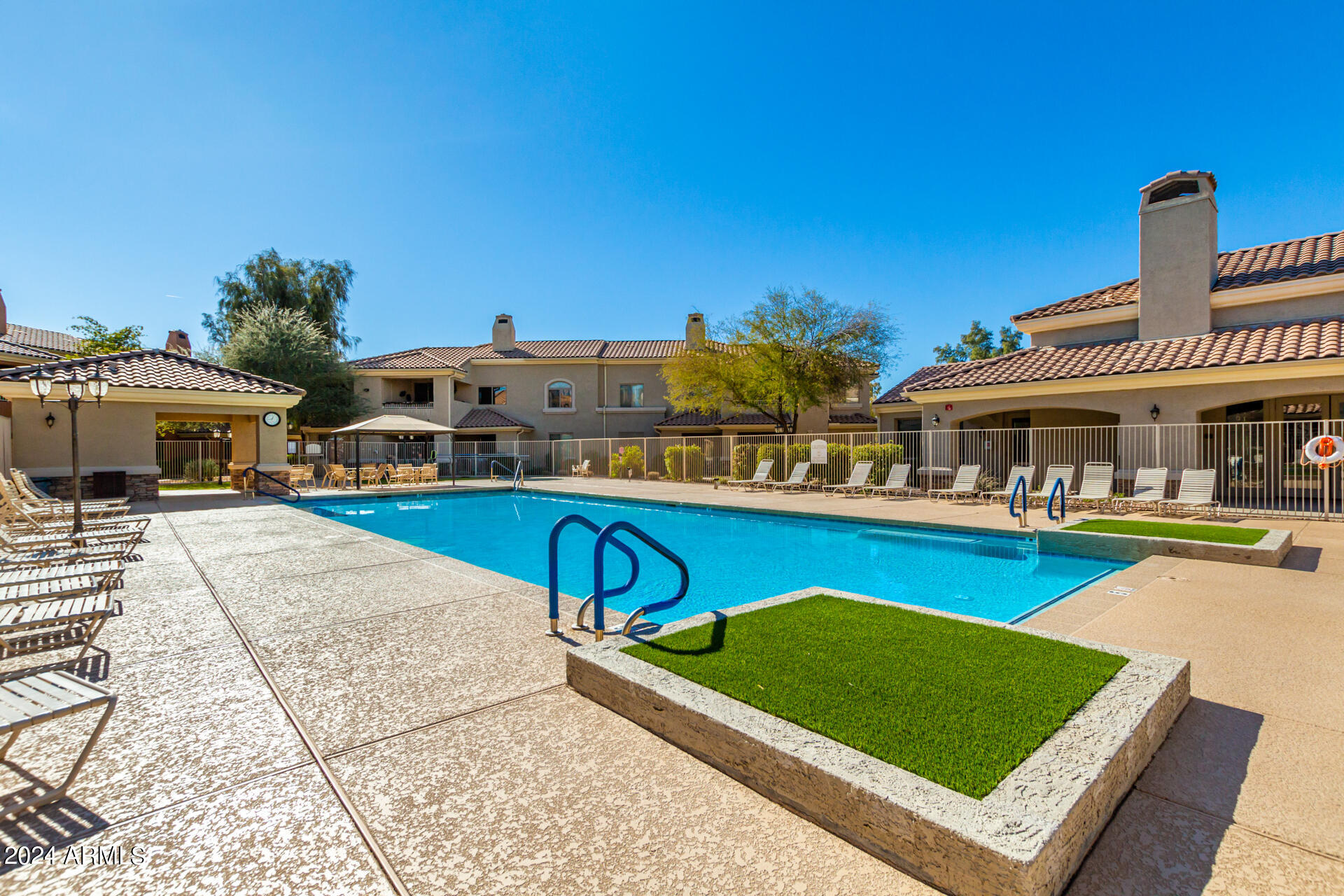 955 East Knox Road, Unit 244 Chandler, AZ 85225 - Photo 40 of 47 a view of a house with pool and chairs
