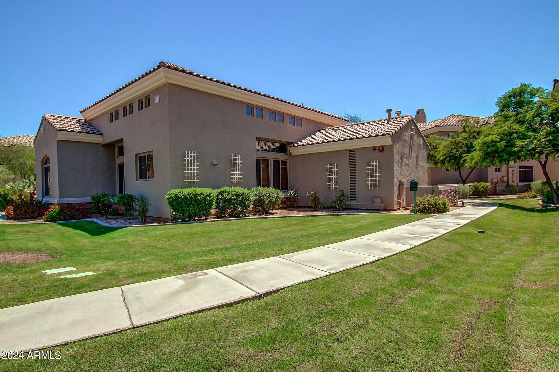 955 East Knox Road, Unit 244 Chandler, AZ 85225 - Photo 44 of 47 a front view of a house with a yard