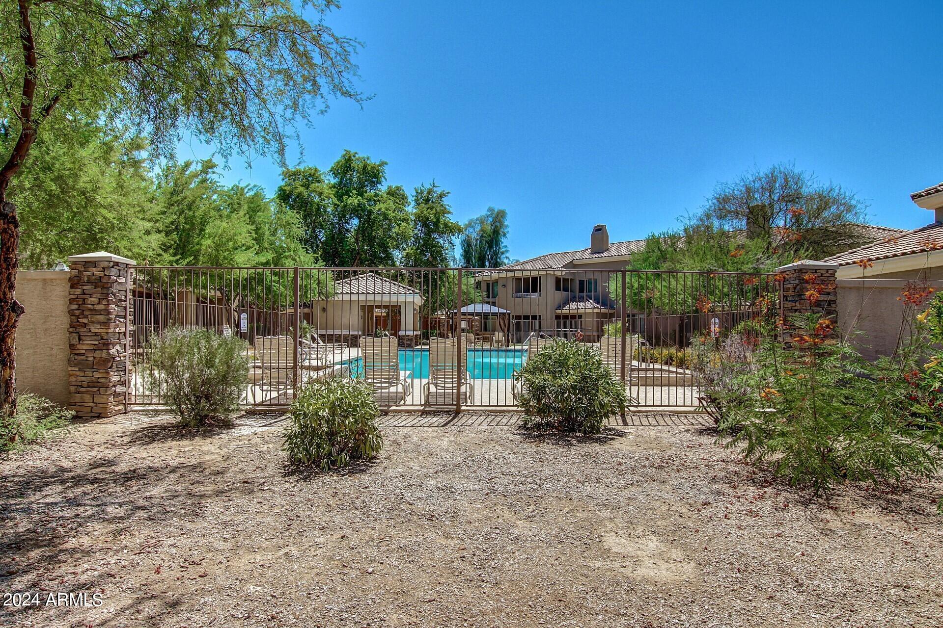 955 East Knox Road, Unit 244 Chandler, AZ 85225 - Photo 45 of 47 a backyard of a house with lots of green space