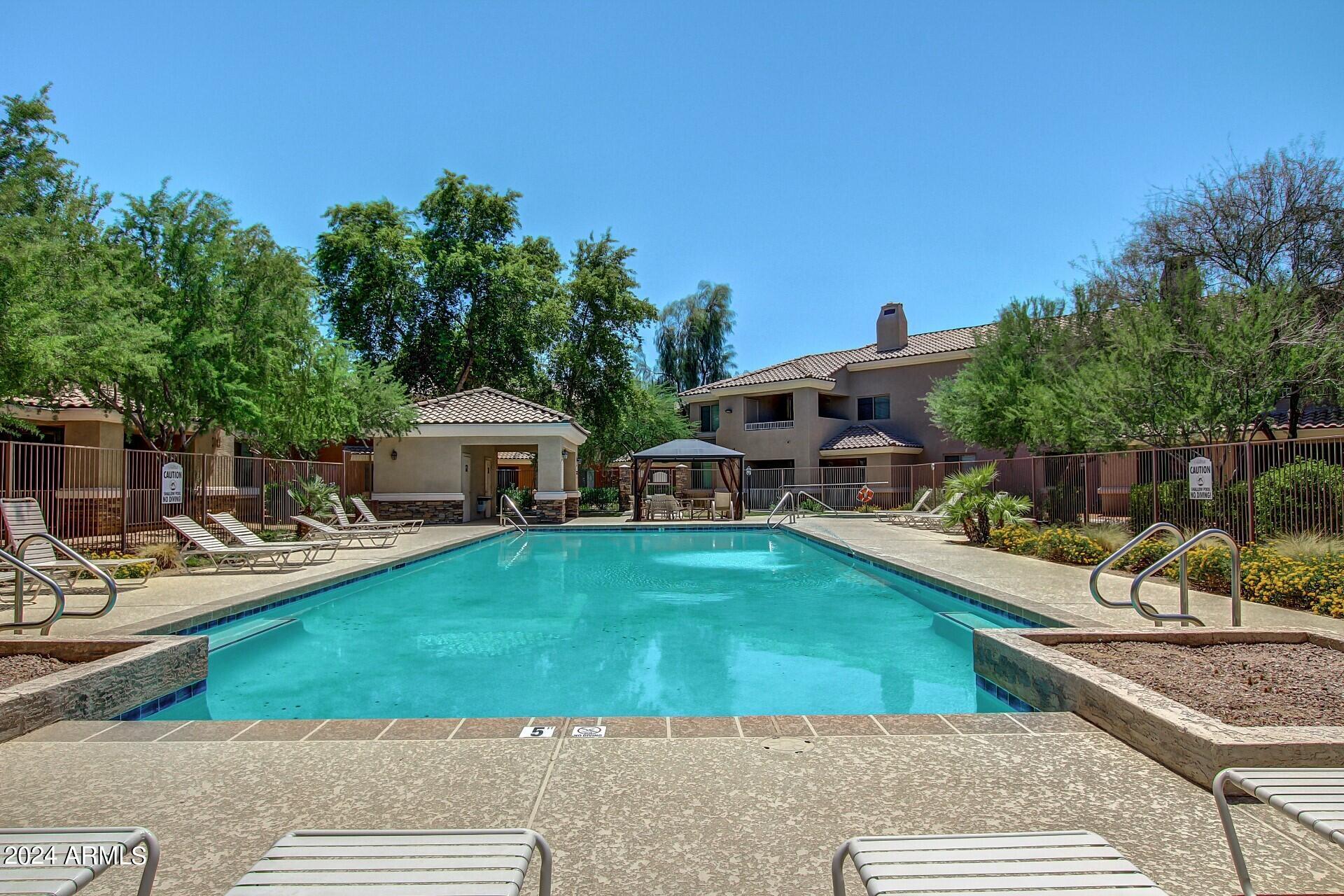 955 East Knox Road, Unit 244 Chandler, AZ 85225 - Photo 46 of 47 a view of a house with swimming pool and sitting area