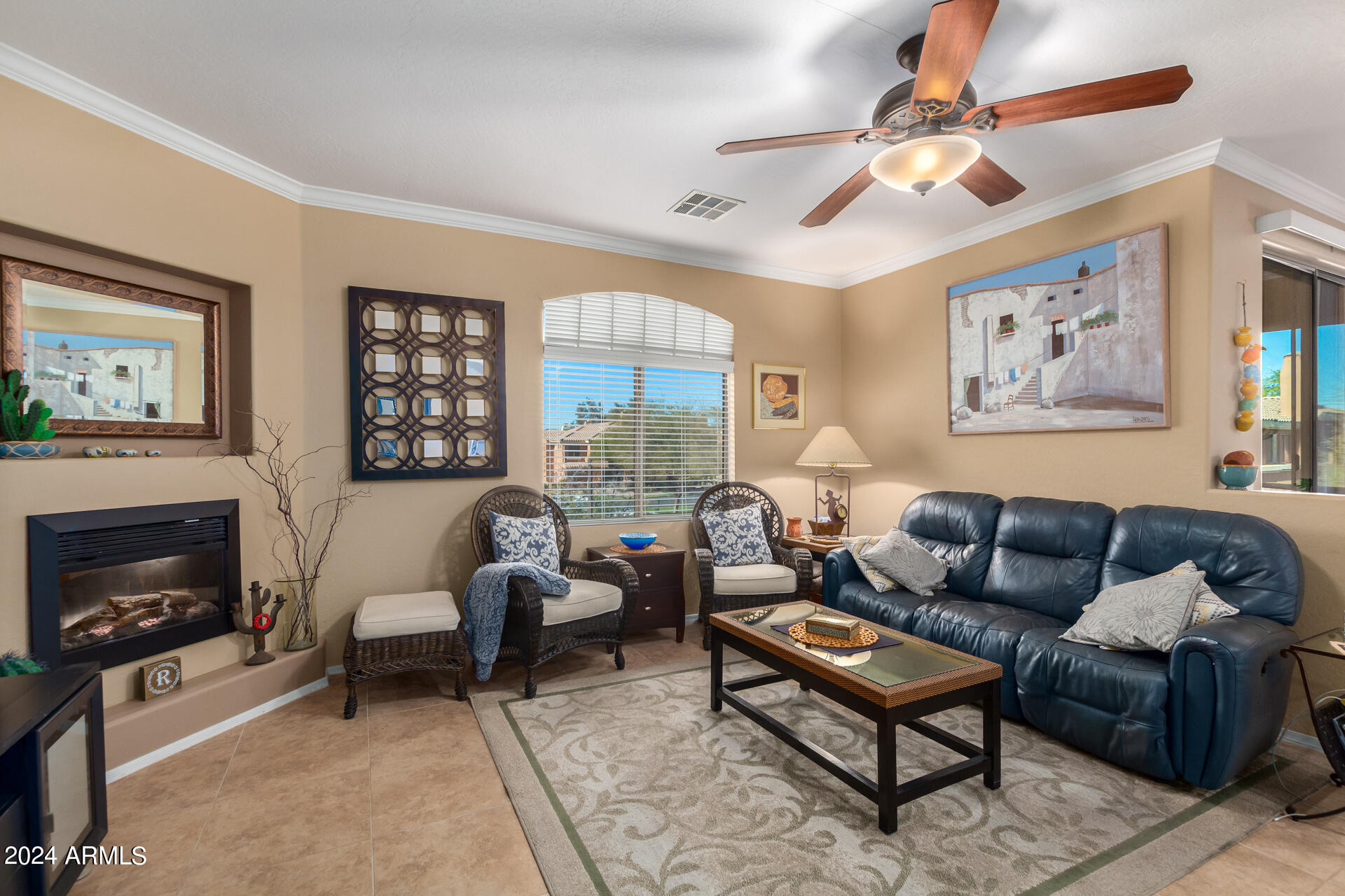 955 East Knox Road, Unit 244 Chandler, AZ 85225 - Photo 5 of 47 a living room with furniture a fireplace and a flat screen tv