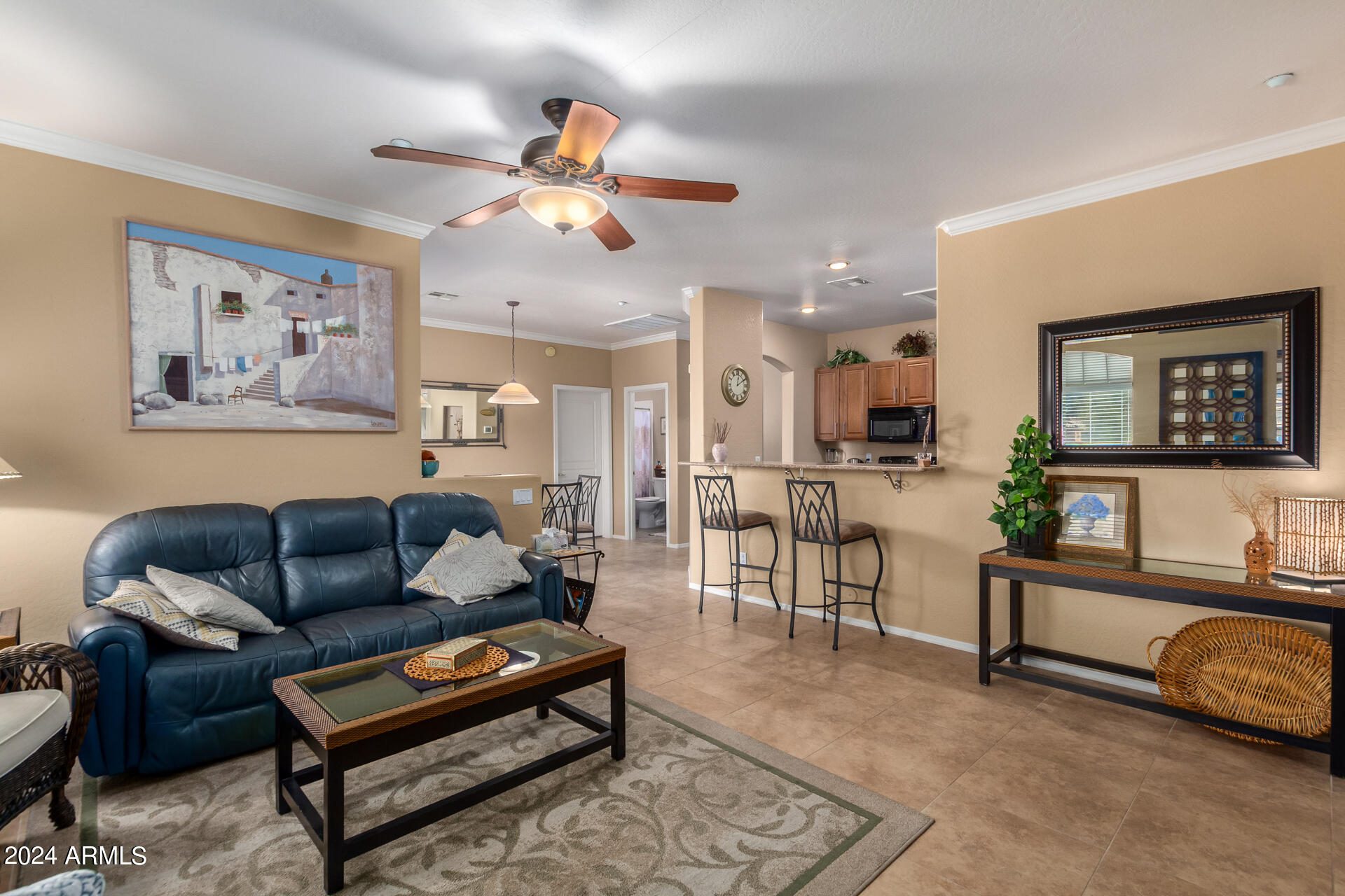 955 East Knox Road, Unit 244 Chandler, AZ 85225 - Photo 6 of 47 a living room with furniture and wooden floor