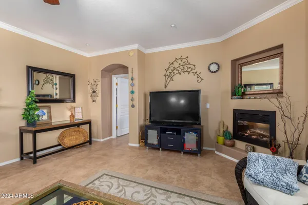 a view of a dining room with furniture wooden floor and a chandelier