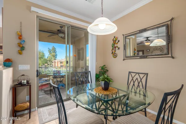a view of a dining room with furniture wooden floor and chandelier