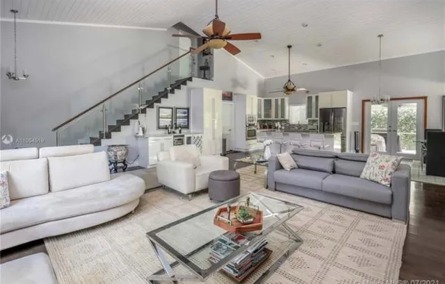 a view of a dining room with furniture wooden floor and chandelier