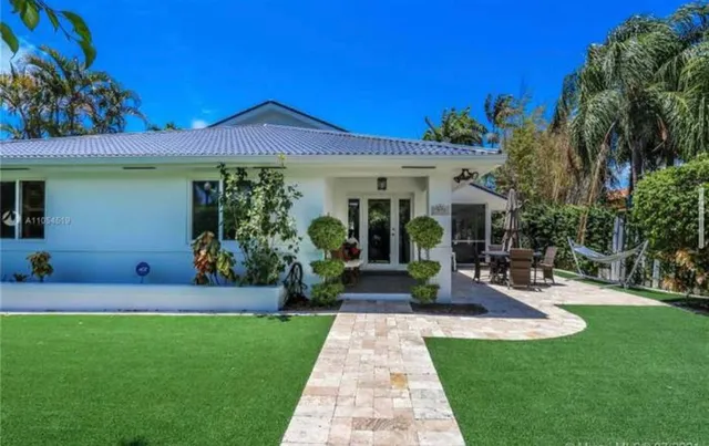 an aerial view of multiple houses with yard