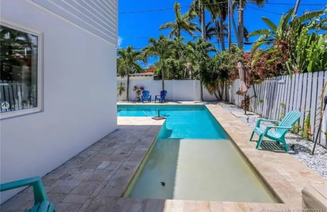 a bedroom with a bed and a table in it