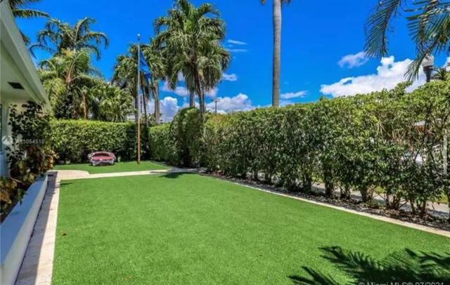 a view of a garden with a building