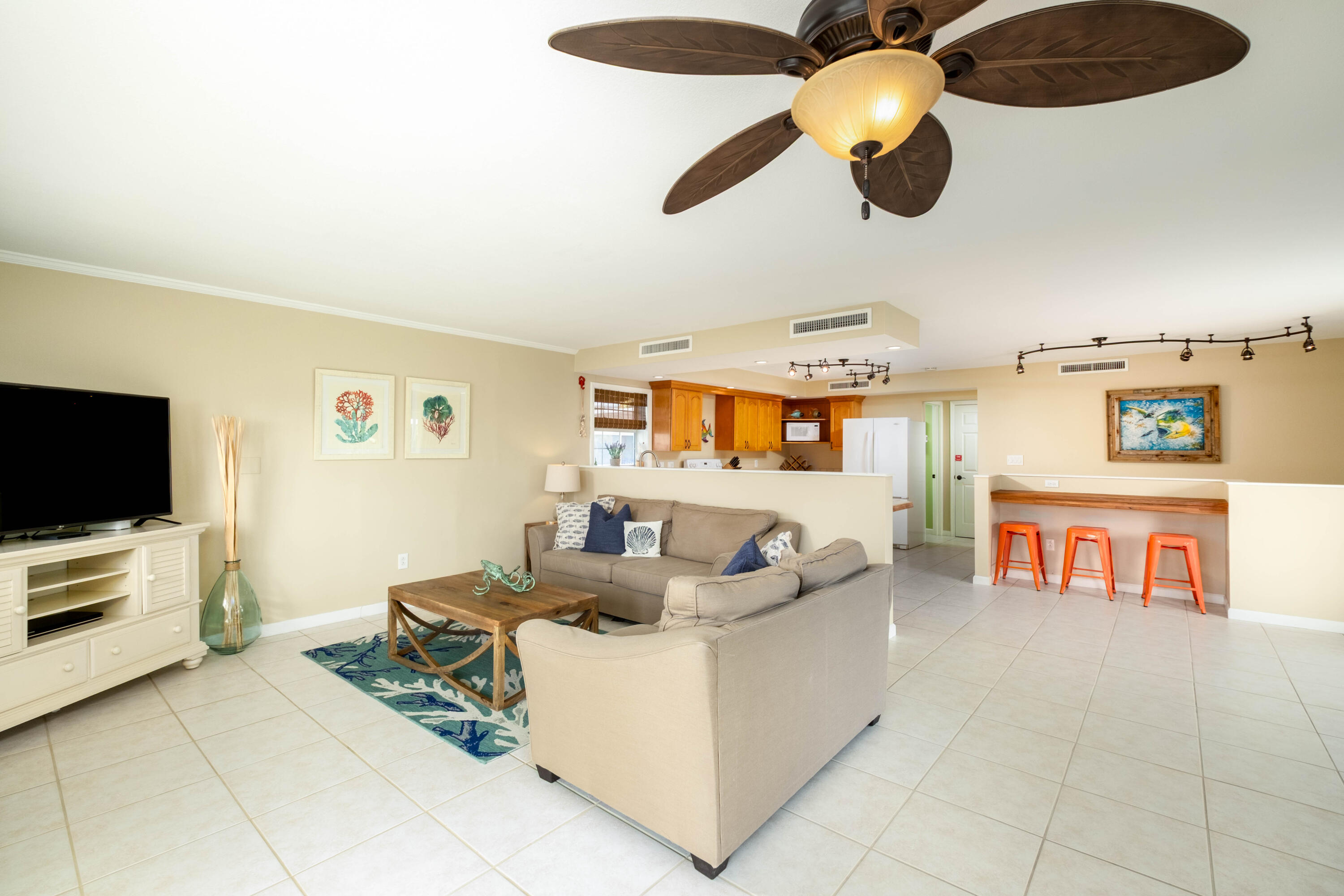 1202 Mockingbird Road Key Largo, FL 33037 - Photo 15 of 38 a living room with furniture and a flat screen tv