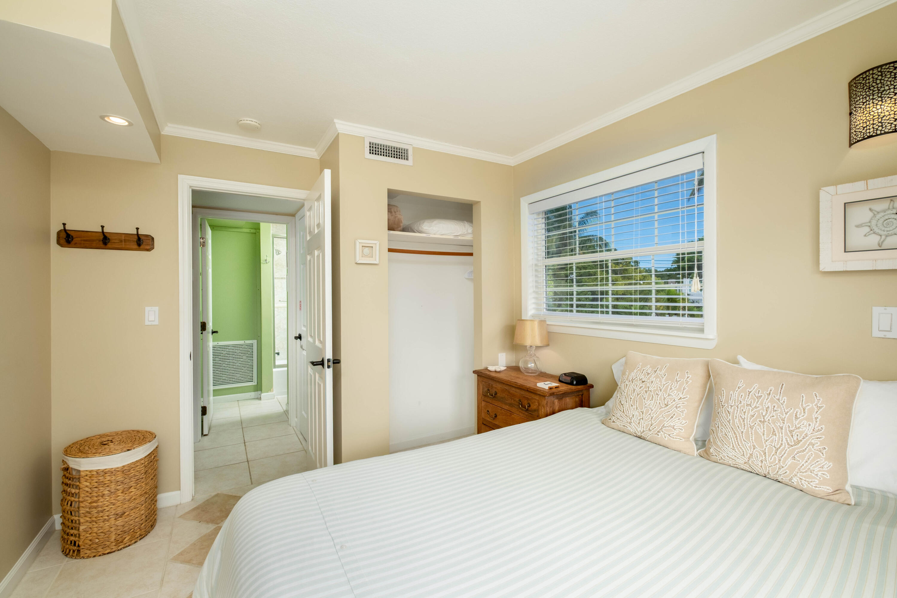 1202 Mockingbird Road Key Largo, FL 33037 - Photo 17 of 38 a bedroom with a bed and a couch