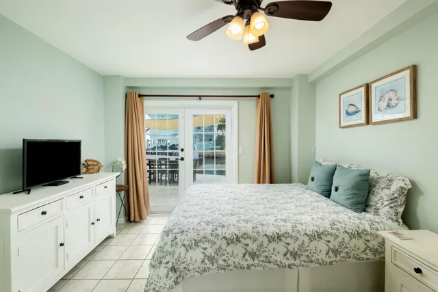 a bedroom with two beds and a window
