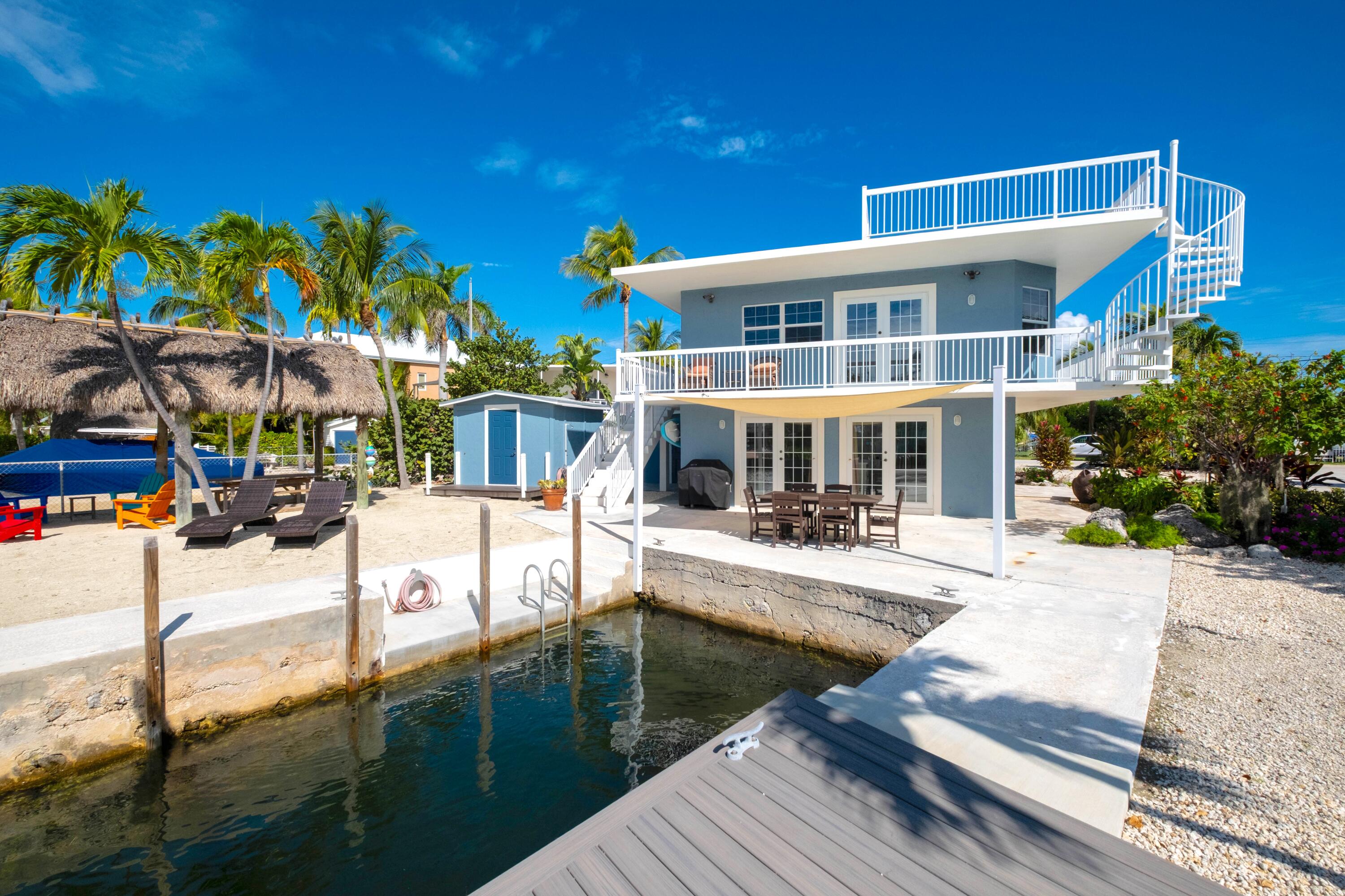1202 Mockingbird Road Key Largo, FL 33037 - Photo 30 of 38 a view of a house with swimming pool